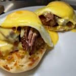 Short Rib Eggs Benedict - Braised short ribs, English muffin, sunny side eggs, hollandaise sauce, on a hashbrown