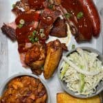 Freddy J's Full BBQ Sampler - Compilation of our house smoked favorites, including ribs, pulled pork, brisket, house sausage, and wings, served with cornbread, baked beans & slaw