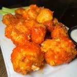 House-Made Buffalo Cheese Curds - Wisconsin-style cheese curds hand-breaded in seasoned panko tossed in our house Freddy J's buffalo sauce