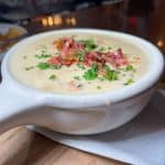 Clam Chowder - A hearty mix of clams, potatoes, and vegetables in a cream broth