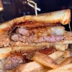 PB&J Burger - Our patties dressed with salty peanut butter sauce, bourbon bacon jam, bacon & muenster cheese served between two slices of toasted bread