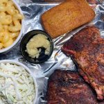 Top down look at Half Rack of Ribs Combo with Cole Slaw, Mac & Cheese, and Cornbread with Honey Butter