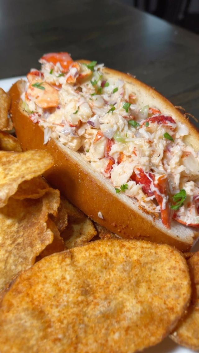 The essence of summer, captured in one bite! 🦞☀️

Dive deep into our house-made lobster salad, 
nestled just right in a buttered & toasted bun, 
and that sumptuous drizzle of pure, melted butter. 🍞🌊 

Adding to the symphony is the crispy crunch 
of our signature house-made chips on the side. 🍟✨

Don’t let this summer delight slip away. 
Available until the season bids adieu. 
Savor, relish, and let every bite transport you! 🏖️🍴💛