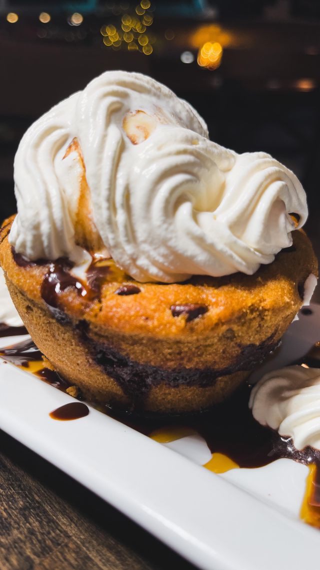 In a world where desserts too often play it safe, 🌍along comes a maverick: our Chocolate Chip Cookie Lava Cake. 🍪💥

Imagine diving into the heart of a cookieonly to be ambushed by a molten rush of chocolate ganache. 🍫🌋

It’s like that unexpected plot twist in your favorite midnight movie,but for your tastebuds. 🎥🍿

Served with a sidekick of vanilla ice cream to cool things off –because let’s face it, things just got steamy. 🔥🍦

If food had personalities, this dessert would be the life of the party,probably shirtless, and definitely unforgettable. 🎉

Dive in, and remember: calories on adventures don’t count. 😉🏊‍♂️